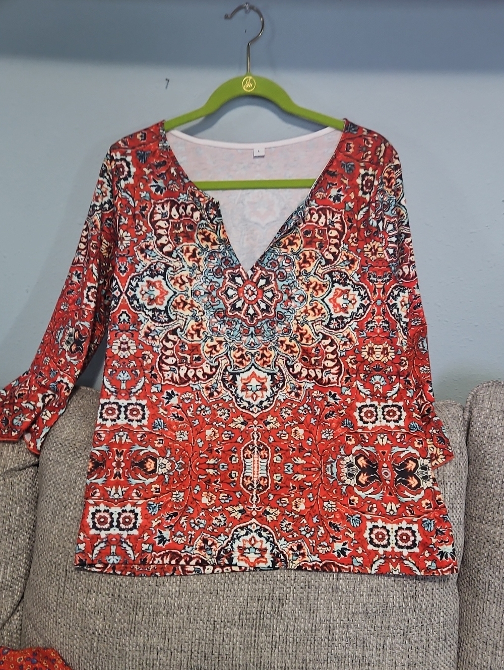 WOMEN'S RED MEDALLION V-NECK TOP